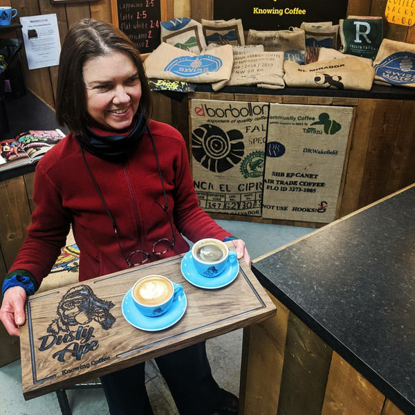 Dusty Ape - Barista Serving Coffee in the Roastery.